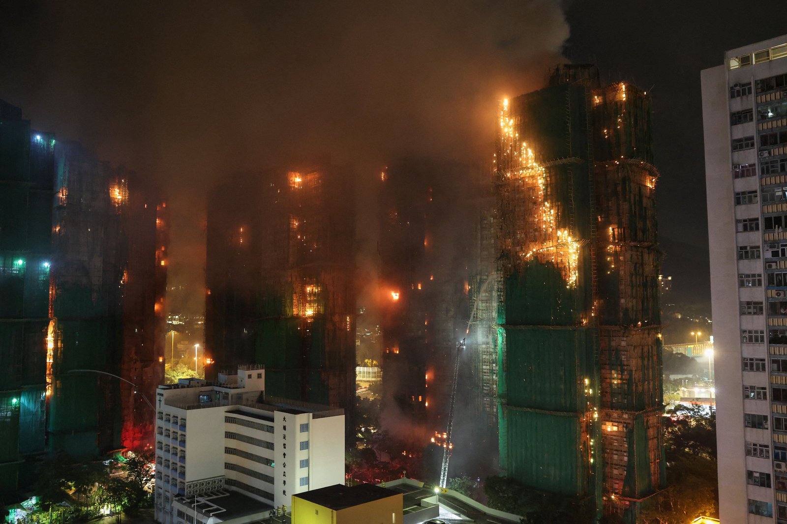 Deadly blaze engulfs high-rise apartment buildings in Hong Kong