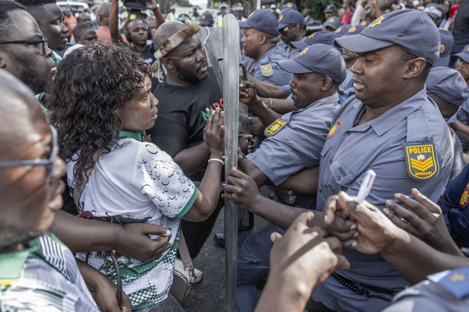 South Africa police clash with displaced migrants