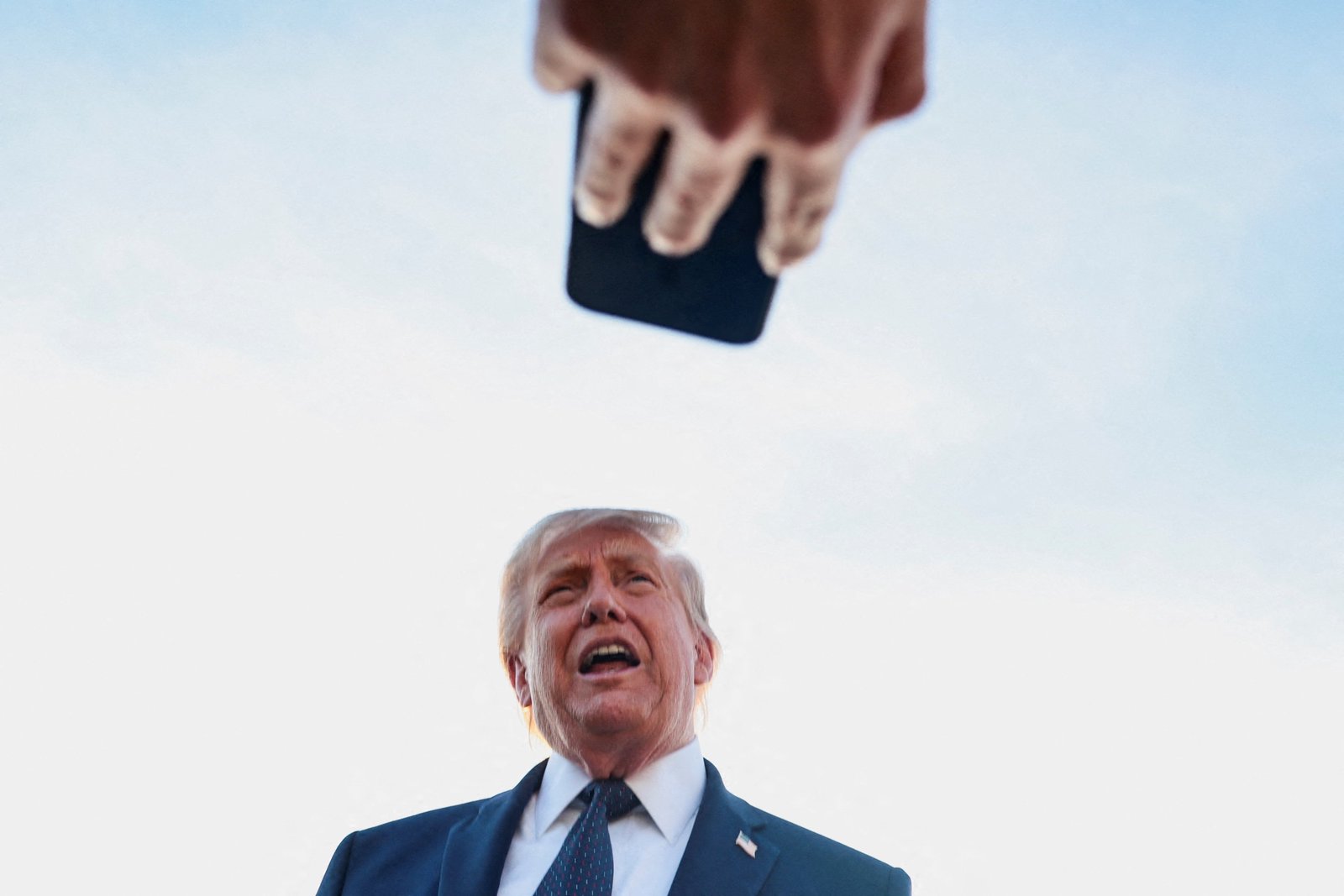 Trump defends Iran deal after markets forced his hand