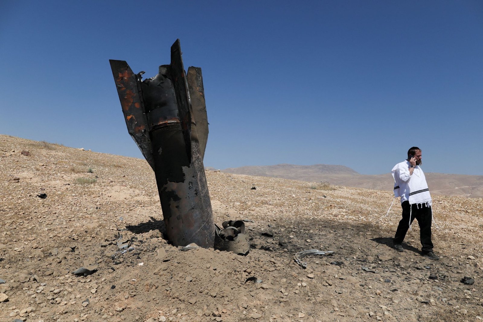Iran says it has halted strikes on Israel