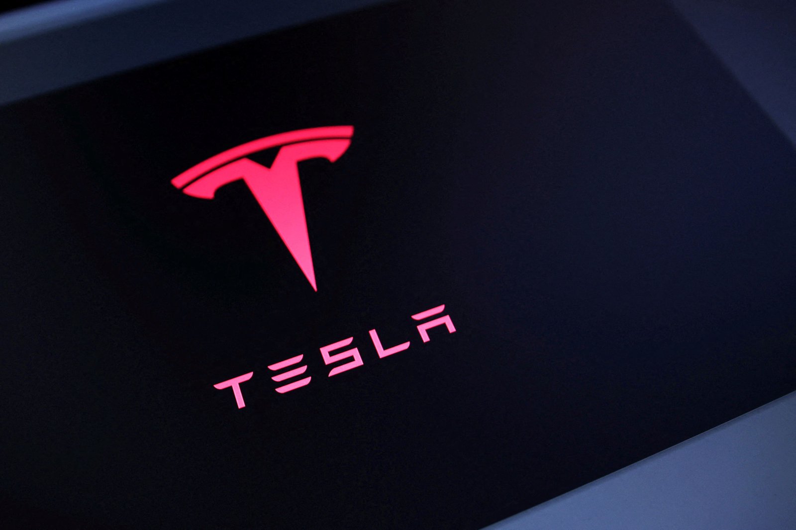 Tesla reports sales up, but profits down